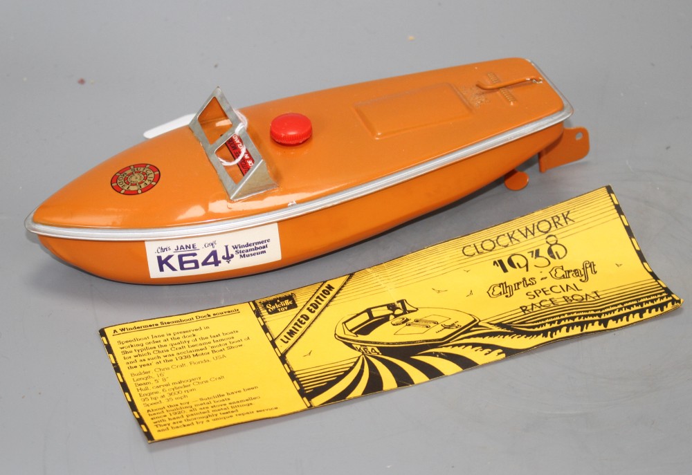 A Sutcliffe Chris-Craft Jane K64 enamelled clockwork special race boat, made for Windermere Steamboat Museum, complete with label, badg